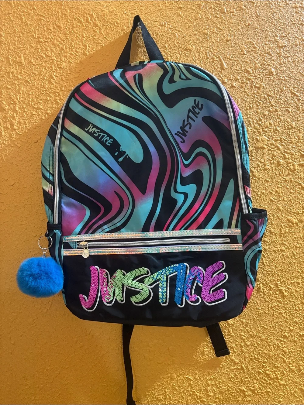Justice Swirl Backpack in Teal, Pink, Purple & Black with Blue Pom